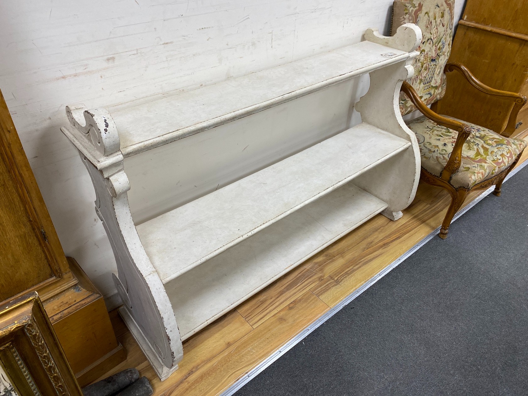 A pair of Victorian painted open bookcases, length 156cm, depth 46cm, height 102cm